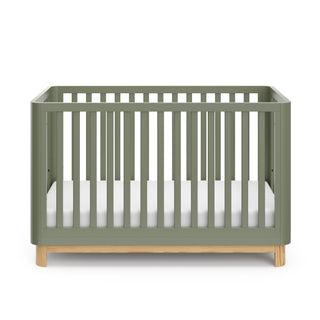 Front view of an olive crib with a natural wood color base