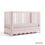 Casablanca blush crib with 2024 Storkcraft copyright on bottom right