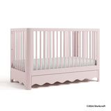 Casablanca blush crib with 2024 Storkcraft copyright on bottom right