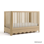Casablanca driftwood crib with 2024 Storkcraft copyright on bottom right