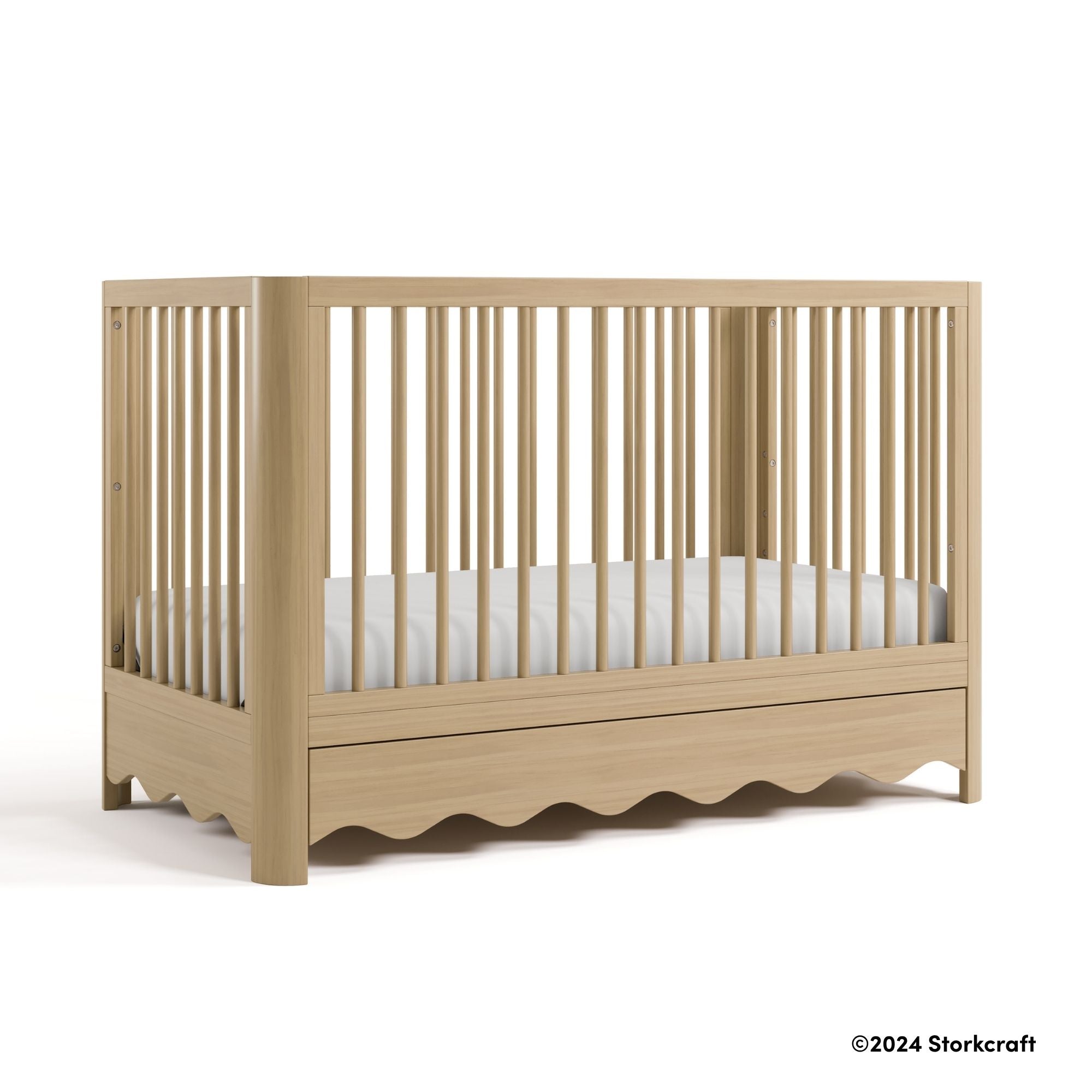 Casablanca driftwood crib with 2024 Storkcraft copyright on bottom right