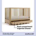 Casablanca driftwood crib angle view with drawer open showing dual-compartment storage drawer callout image