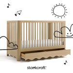 Casablanca driftwood crib angle view with drawer open and black cartoon drawings overlaid on image