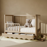 Casablanca driftwood crib with drawer converted to toddler bed with guardrail attached in nursery