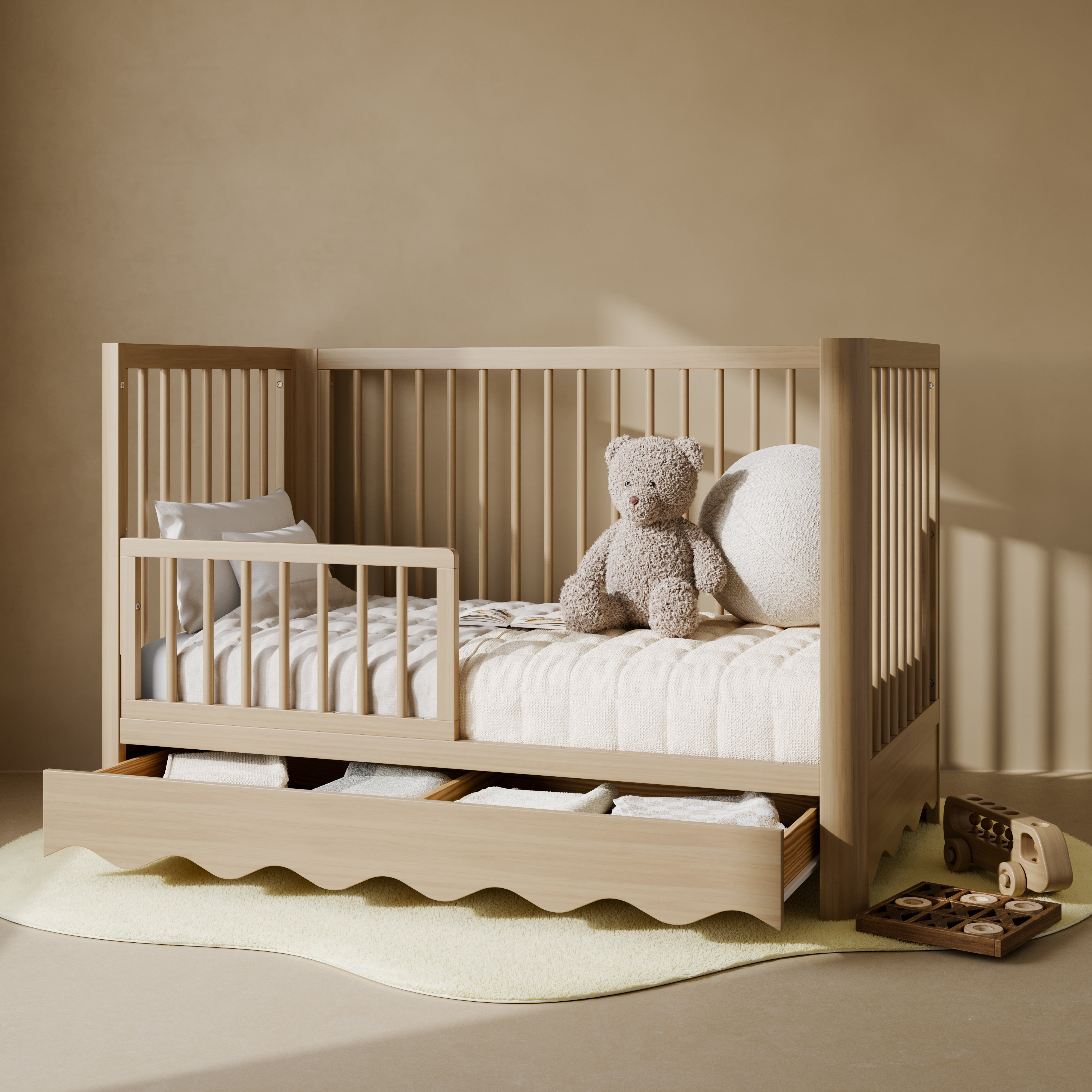 Casablanca driftwood crib with drawer converted to toddler bed with guardrail attached in nursery