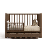 Casablanca hazelnut crib with drawer converted to toddler bed with guardrail attached