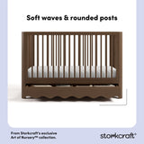 Casablanca hazelnut crib front view showing soft waves and rounded posts callout image