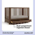 Casablanca hazelnut crib angle view with drawer open showing dual-compartment storage drawer callout image