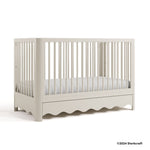 Casablanca frosted oat crib with 2024 Storkcraft copyright on bottom right