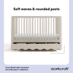 Casablanca frosted oat crib front view showing soft waves and rounded posts callout image