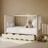 Casablanca frosted oat crib with drawer converted to daybed in nursery