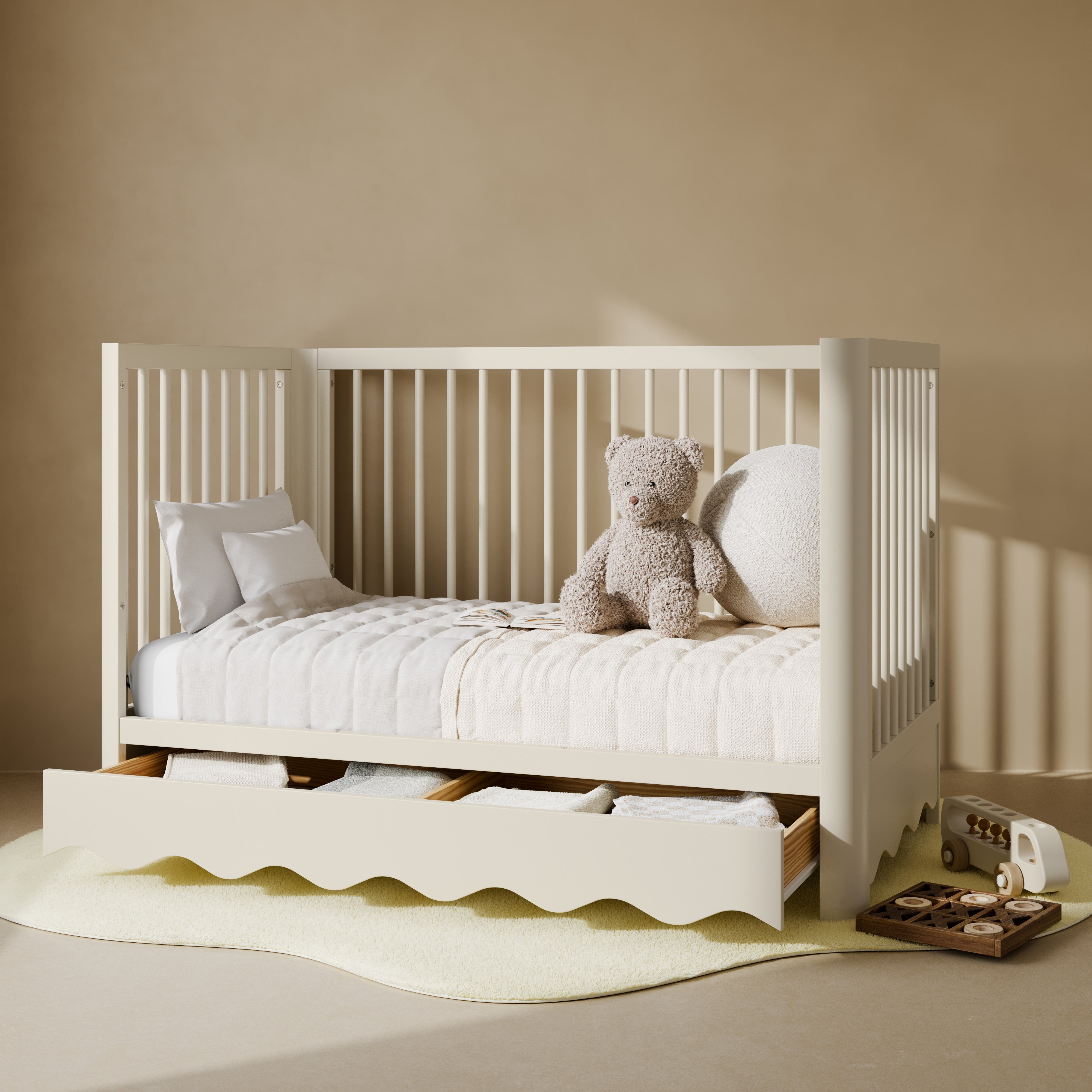 Casablanca frosted oat crib with drawer converted to daybed in nursery