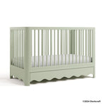Casablanca sage crib with 2024 Storkcraft copyright on bottom right