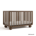 Amalfi hazelnut crib with 2025 Storkcraft copyright on bottom right