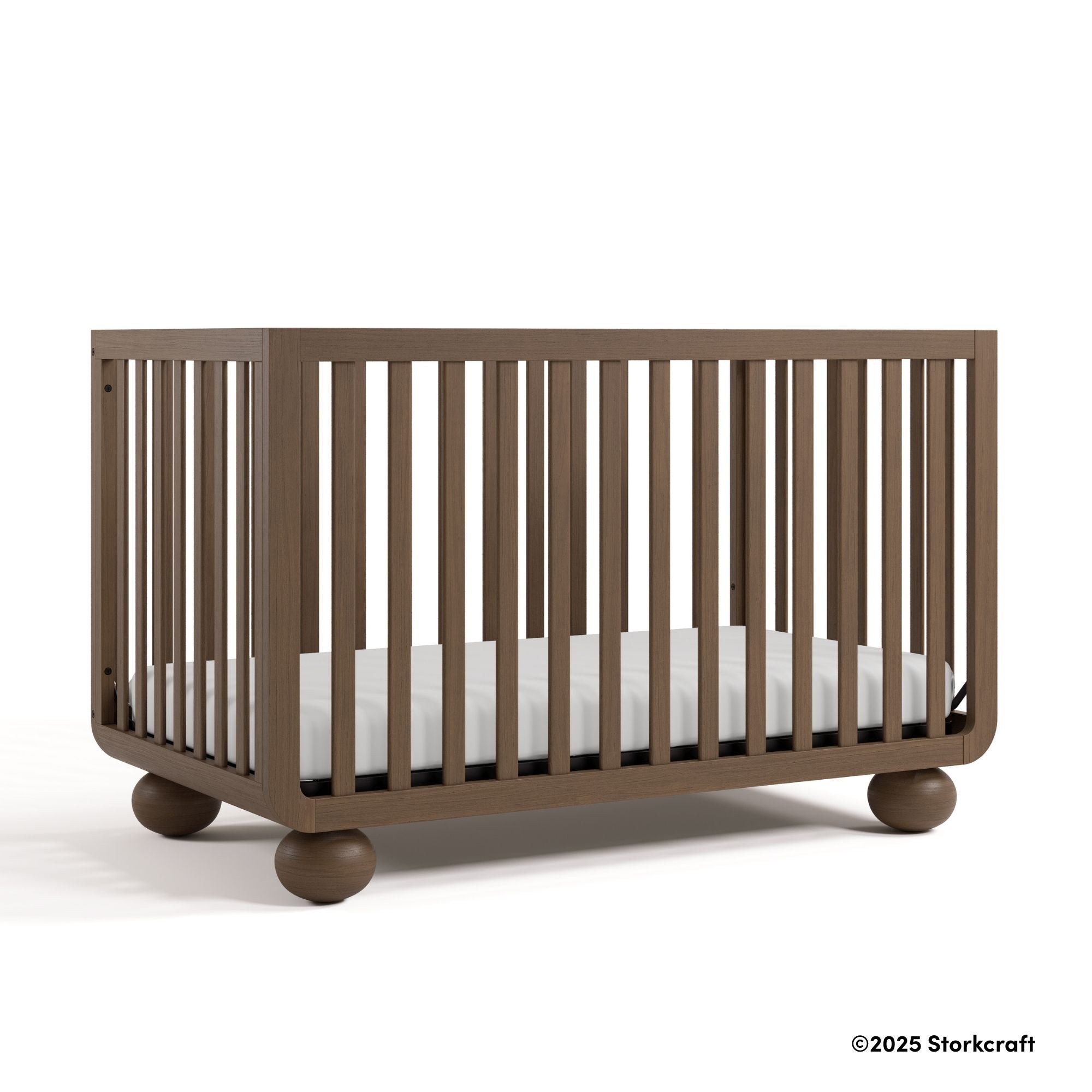 Amalfi hazelnut crib with 2025 Storkcraft copyright on bottom right