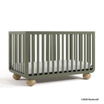 Amalfi olive crib with 2025 Storkcraft copyright on bottom right