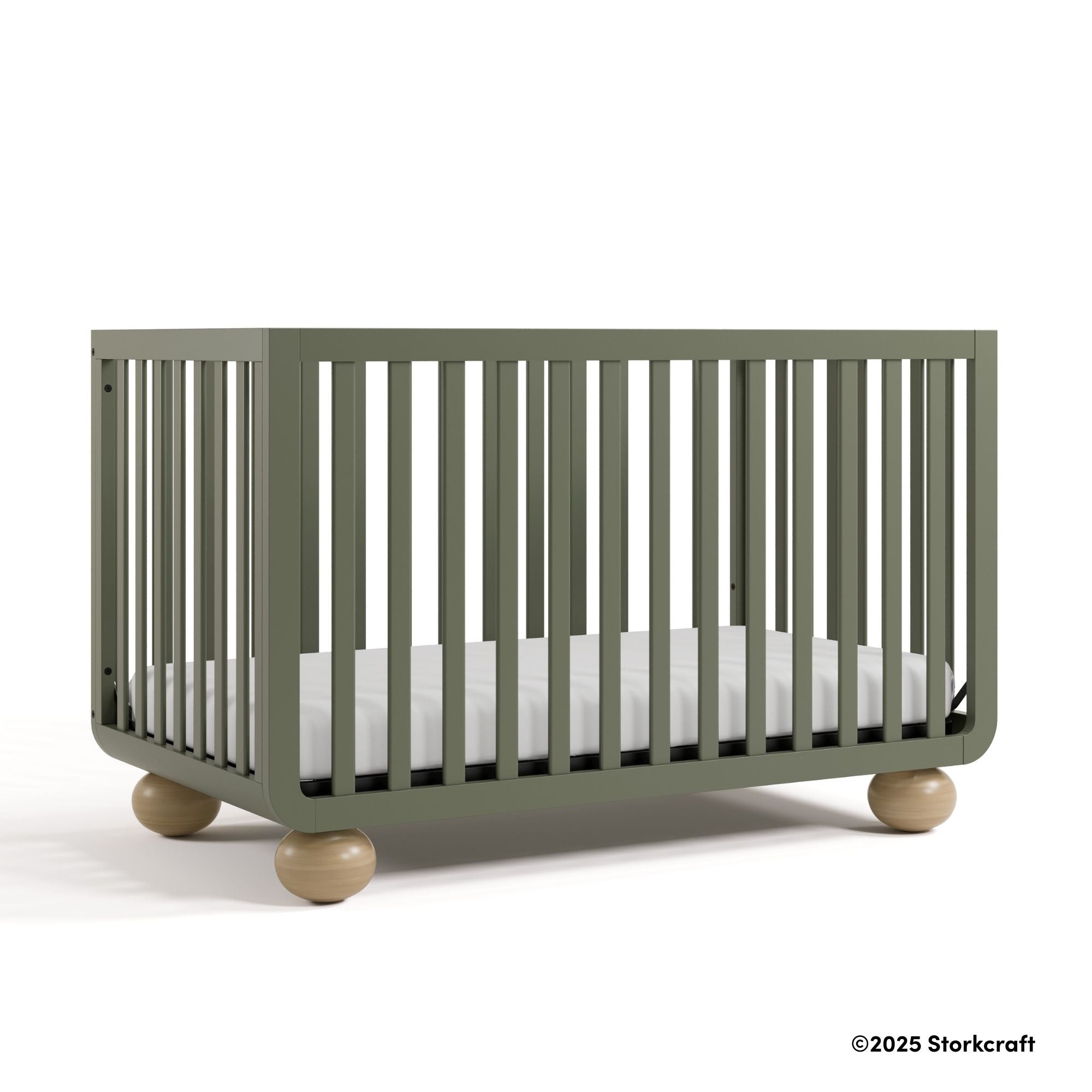 Amalfi olive crib with 2025 Storkcraft copyright on bottom right