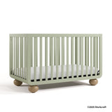 Amalfi sage crib with 2025 Storkcraft copyright on bottom right