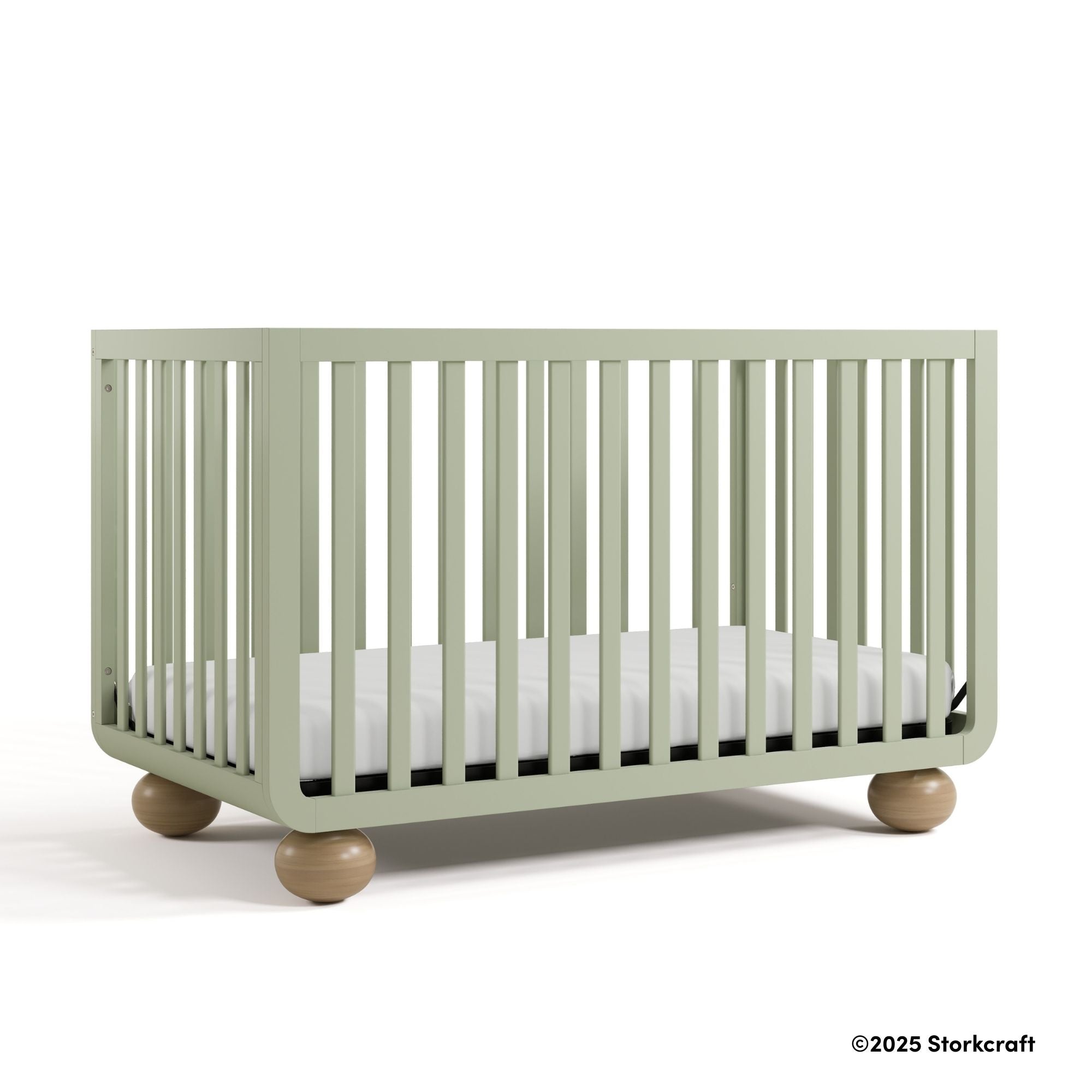 Amalfi sage crib with 2025 Storkcraft copyright on bottom right