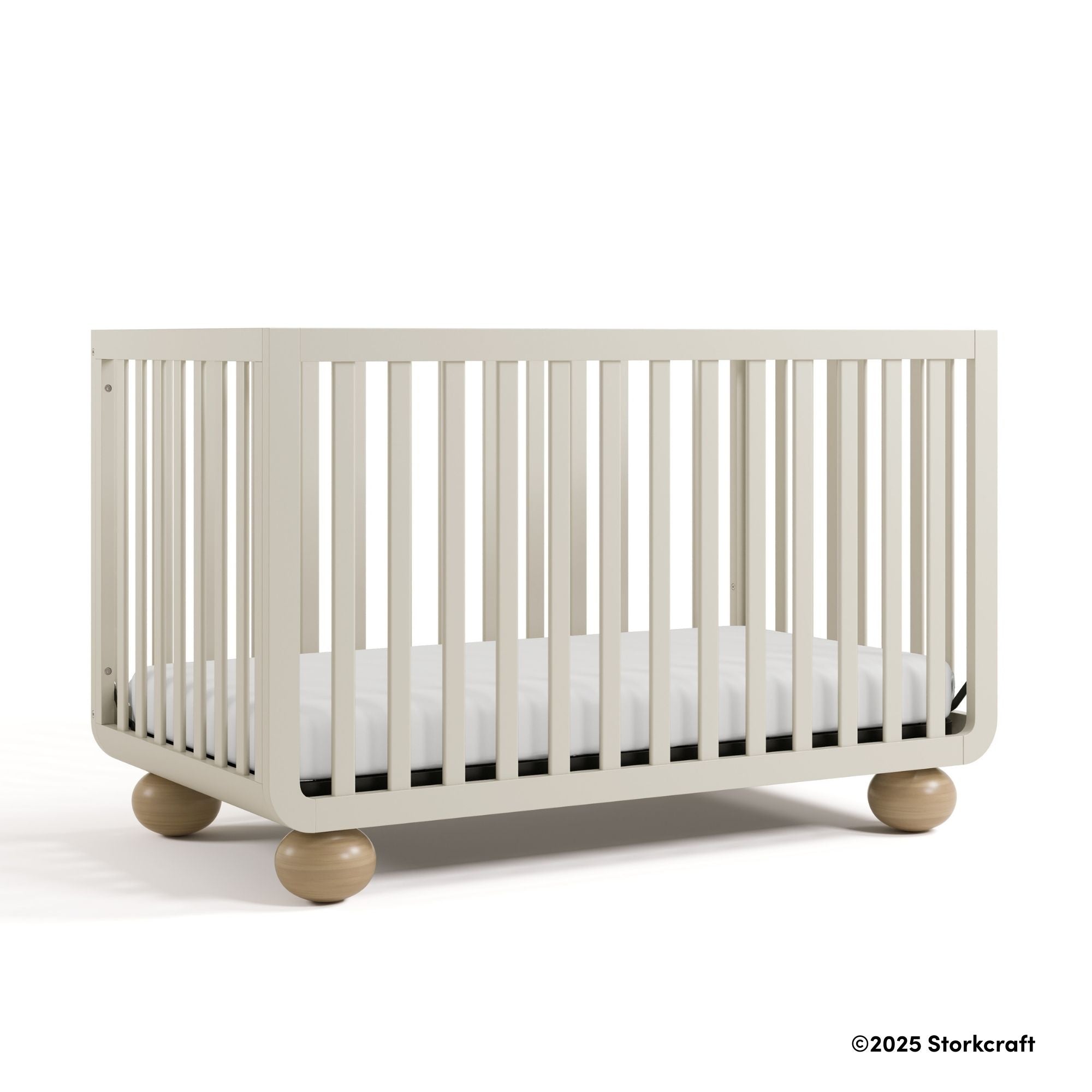 Amalfi frosted oat crib with 2025 Storkcraft copyright on bottom right