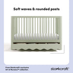 Casablanca sage crib front view showing soft waves and rounded posts callout image