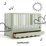 Casablanca sage crib angle view with drawer open and black cartoon drawings overlaid on image