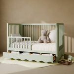 Casablanca sage crib with drawer converted to toddler bed with guardrail attached in nursery