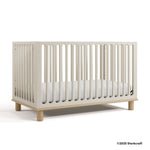 Sicily frosted oat with driftwood crib with 2025 Storkcraft copyright on bottom right