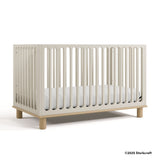 Sicily frosted oat with driftwood crib with 2025 Storkcraft copyright on bottom right
