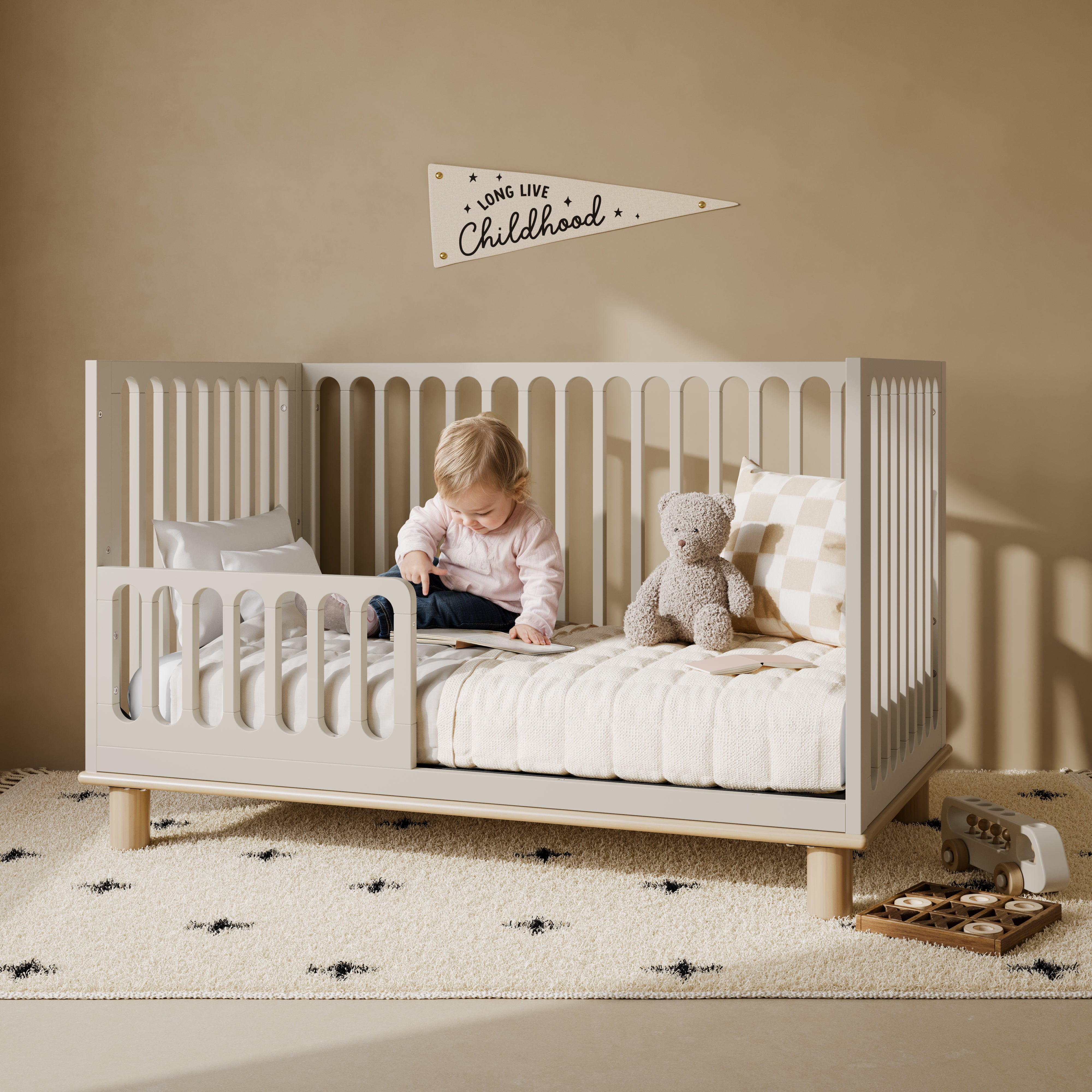 Sicily frosted oat with driftwood crib converted to toddler bed in a nursery