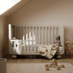 Storkcraft Amalfi Crib in Frosted Oat Toddler Bed stage lifestyle image