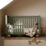 Amalfi olive with driftwood crib converted to toddler bed in nursery