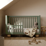 Amalfi olive with driftwood crib converted to toddler bed in nursery