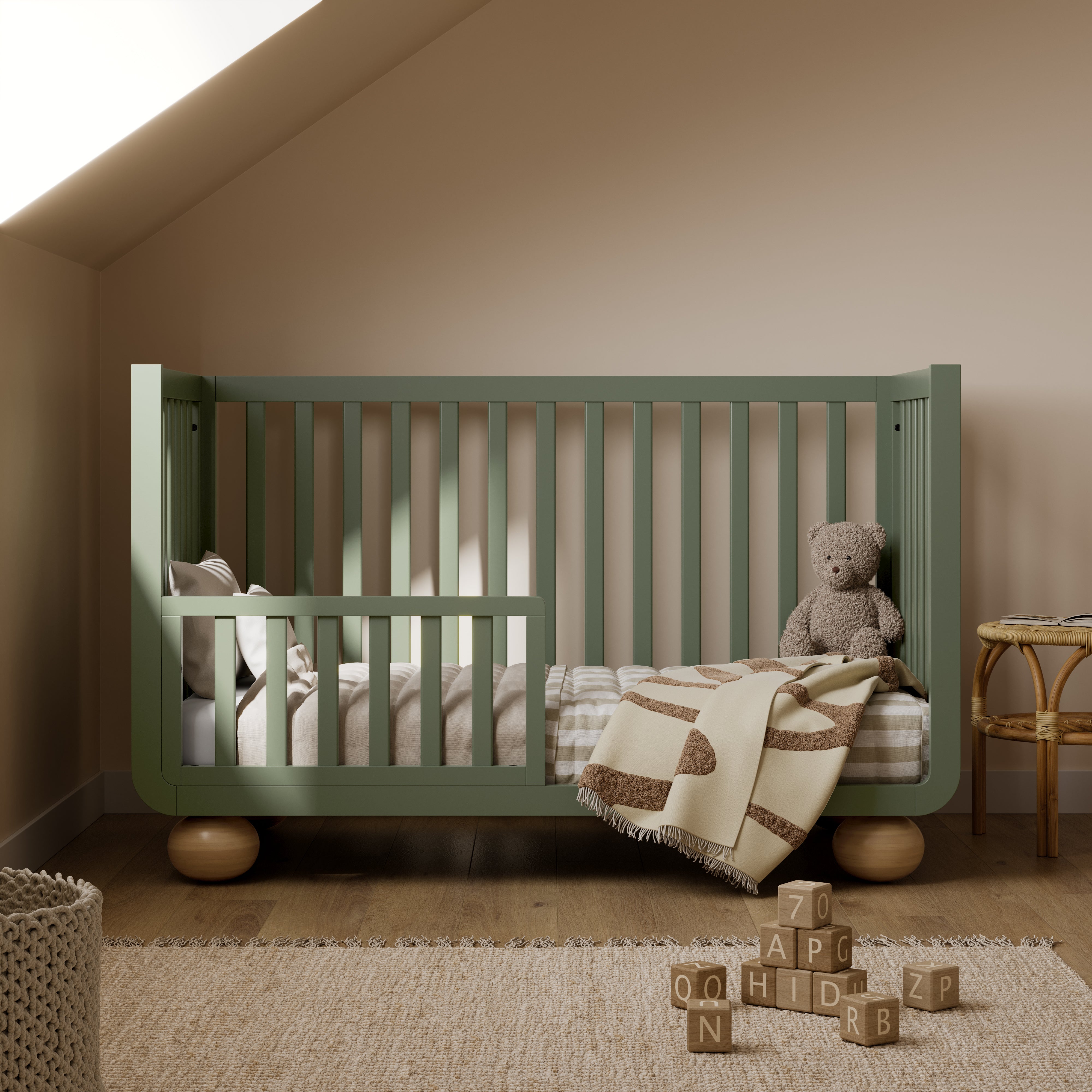 Amalfi olive with driftwood crib converted to toddler bed in nursery