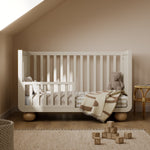 Amalfi frosted oat with driftwood crib converted to toddler bed in nursery