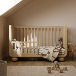 Amalfi driftwood crib converted to toddler bed in nursery