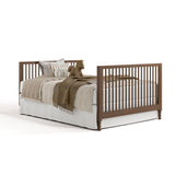 Rio hazelnut crib converted to full-size bed with footboard