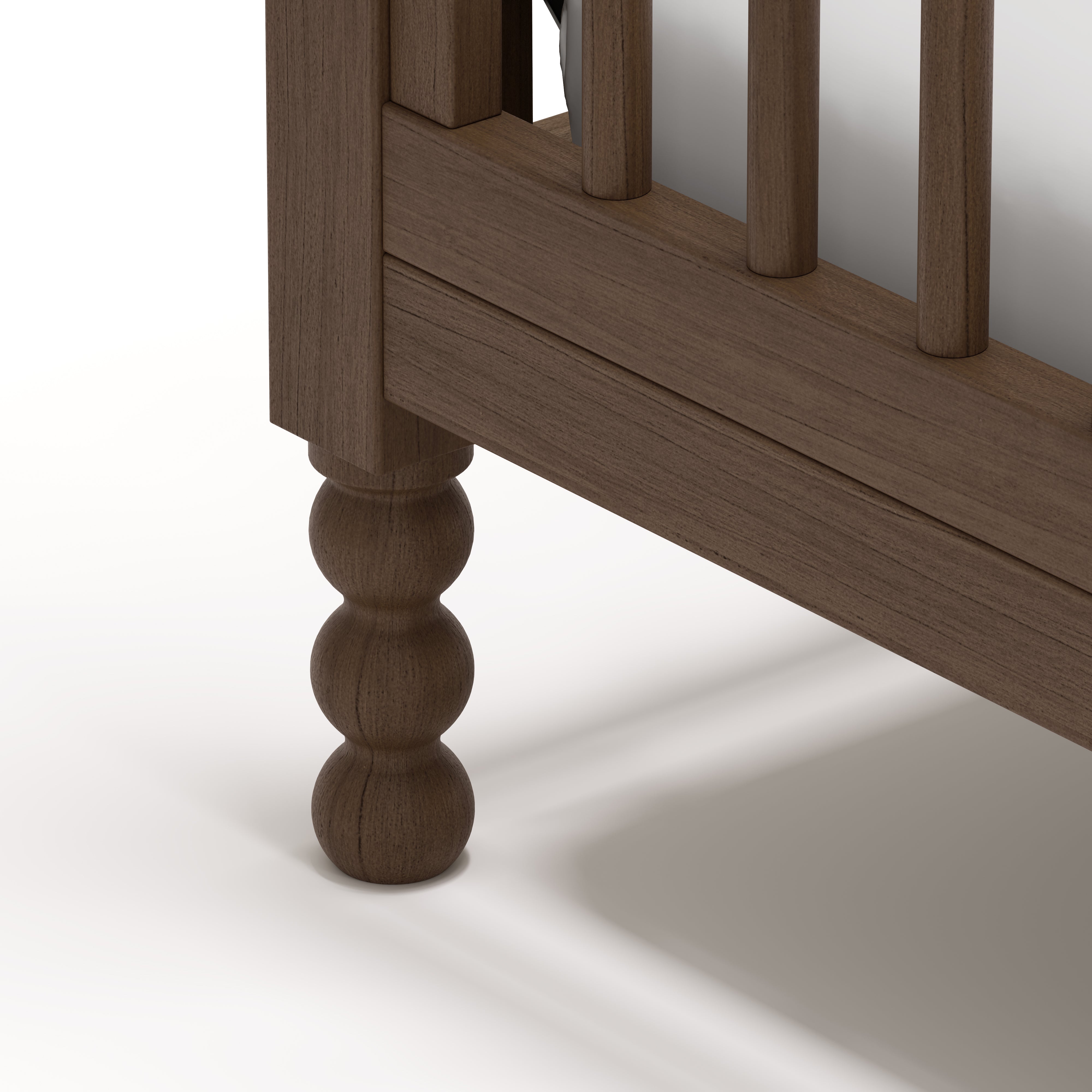 Rio hazelnut crib close up of solid wood turning feet