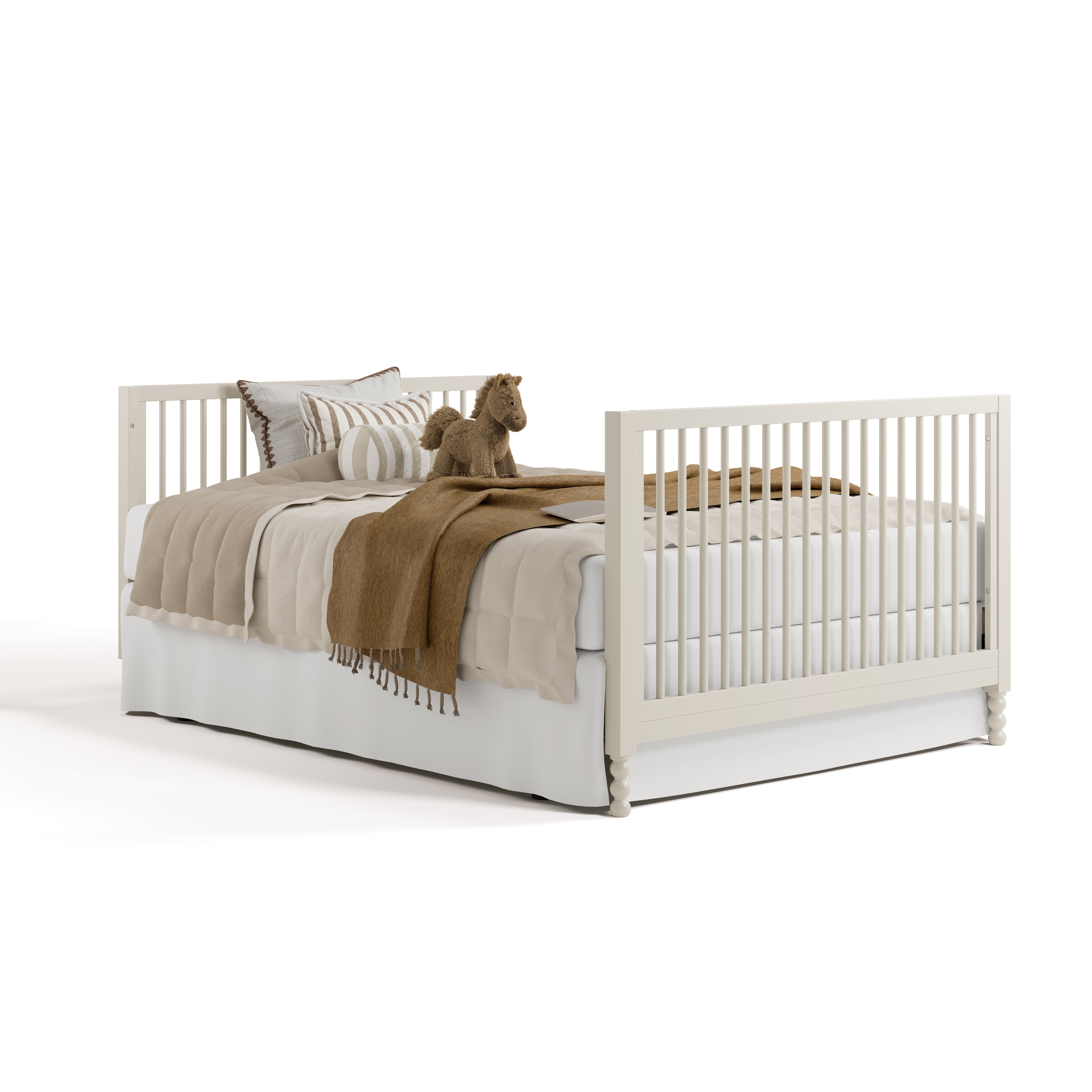 Rio frosted oat crib converted to full-size bed with footboard