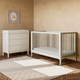 Rio frosted oat crib next to 3 drawer dresser in a nursery