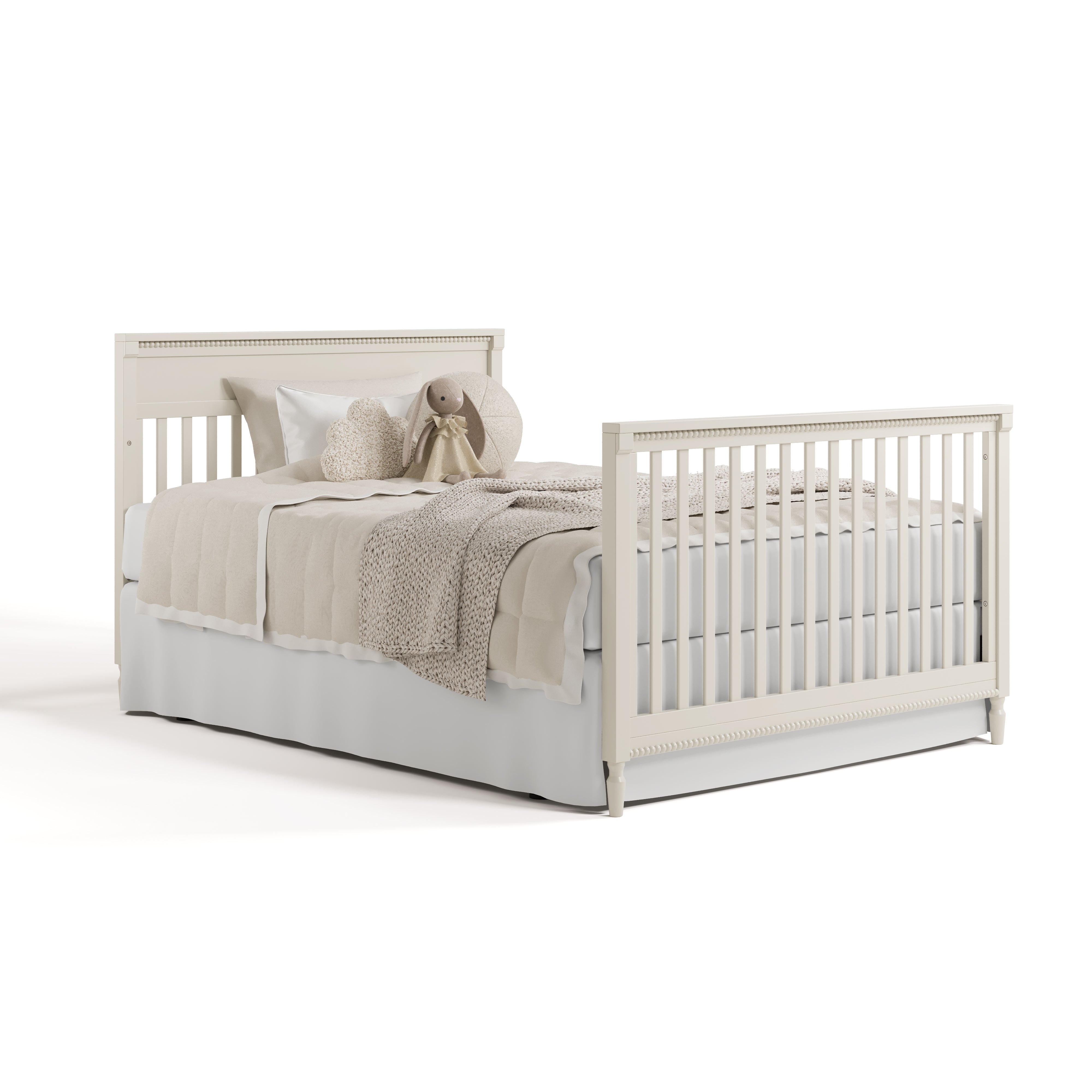 Valencia frosted oat crib converted to full bed with footboard