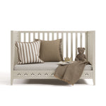 Mallorca frosted oat crib converted to daybed