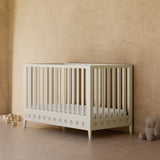 Mallorca frosted oat crib in a nursery
