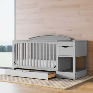 pebble gray crib and changer in nursery