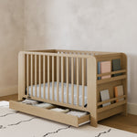 Read-with-Me driftwood crib with drawer in a nursery