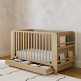 Read-with-Me driftwood crib with drawer in a nursery