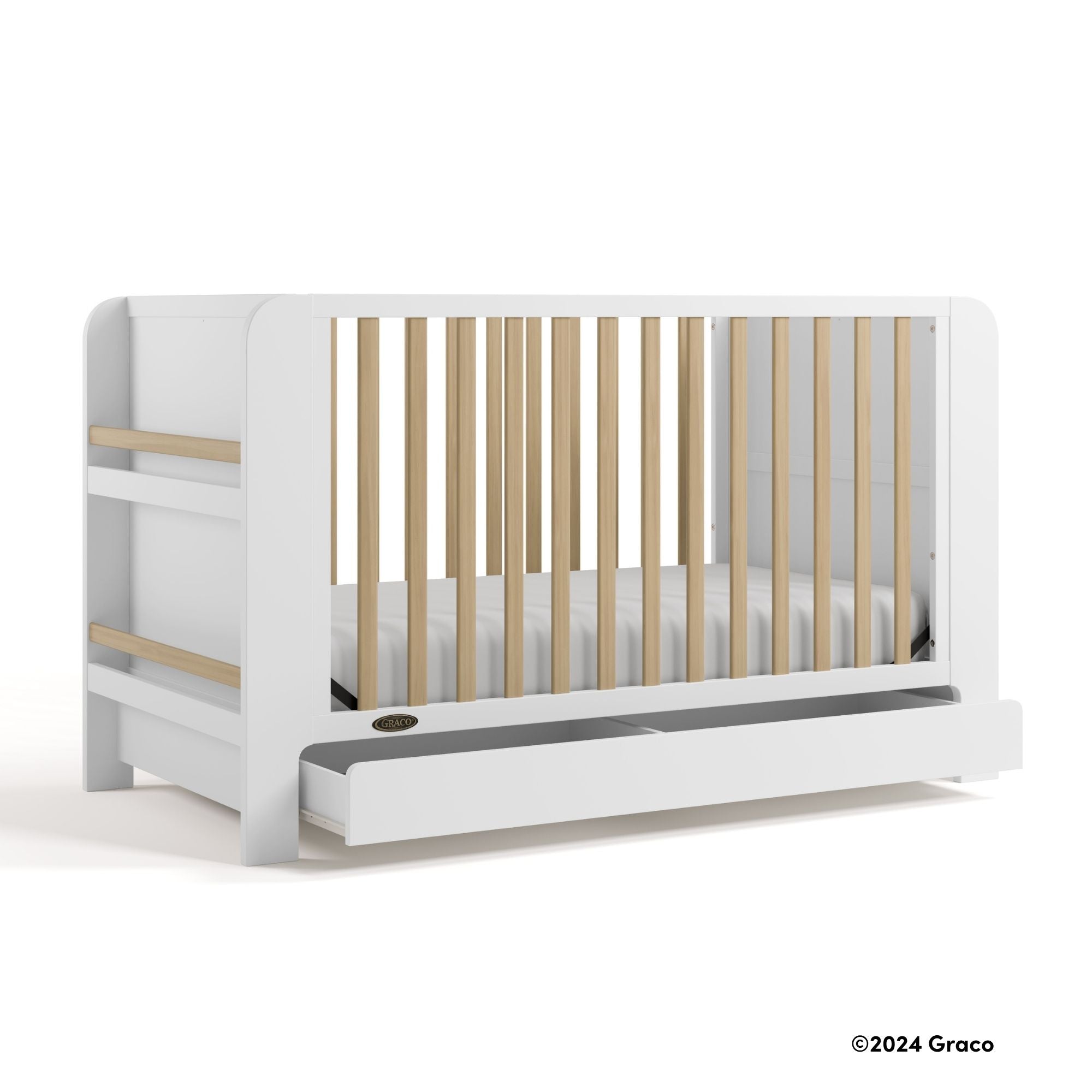 Read-with-me white with driftwood crib with 2024 Graco copyright on bottom right
