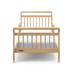 front view of natural toddler bed with guardrails