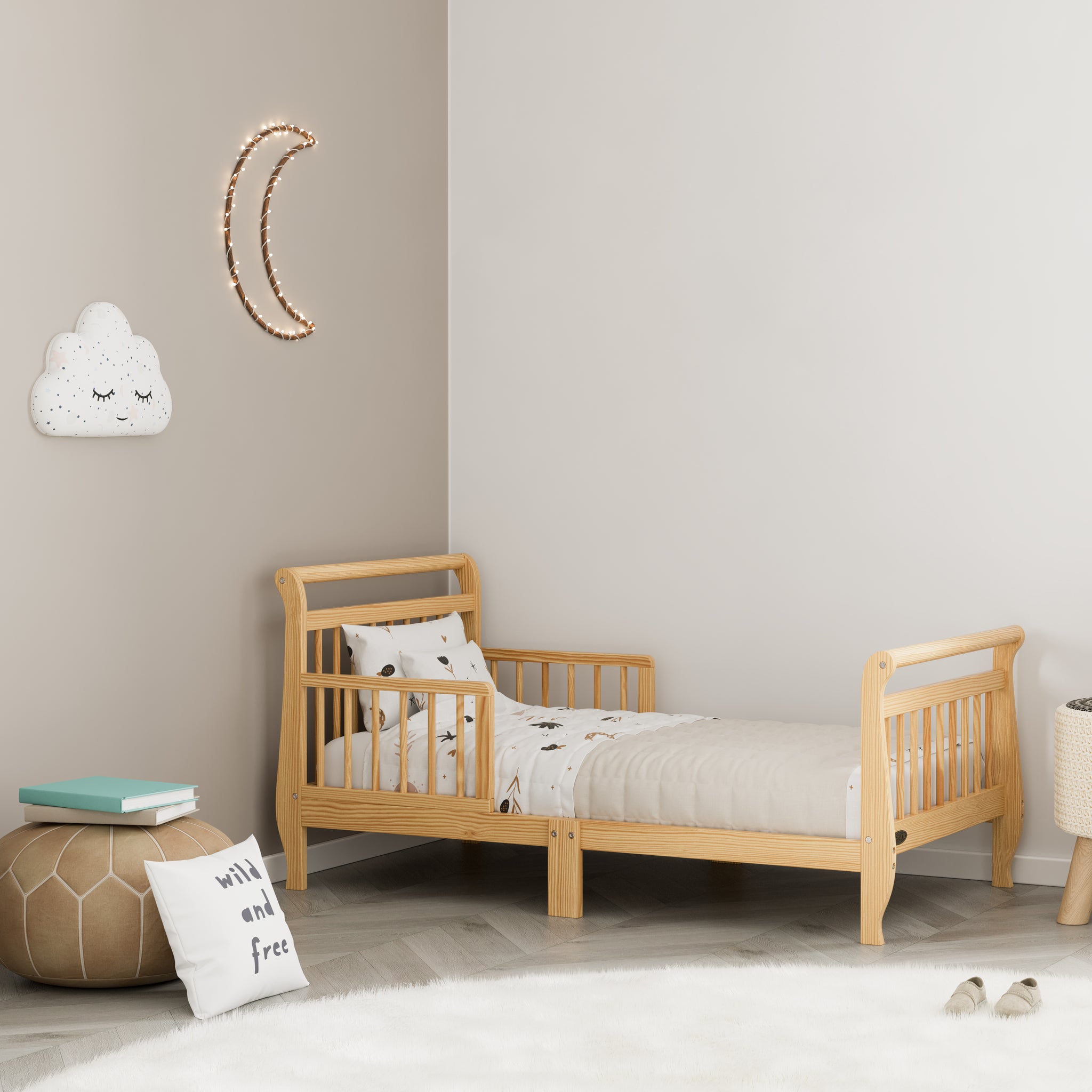 natural toddler bed with guardrails in nursery