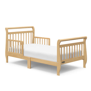 Natural toddler bed with guardrails angled